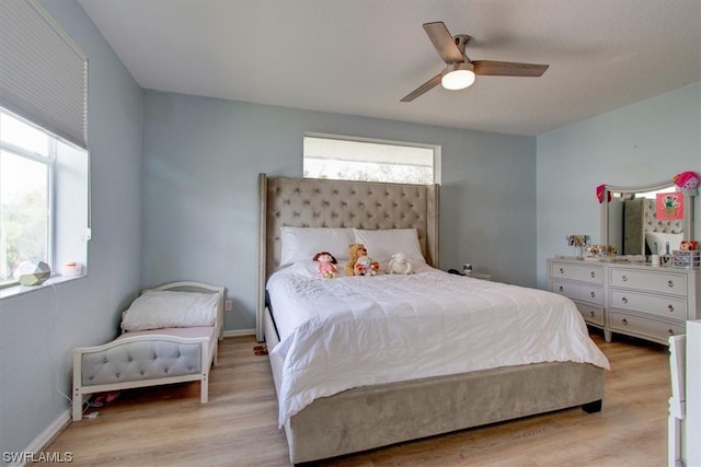 bedroom with ceiling fan and light wood-type flooring