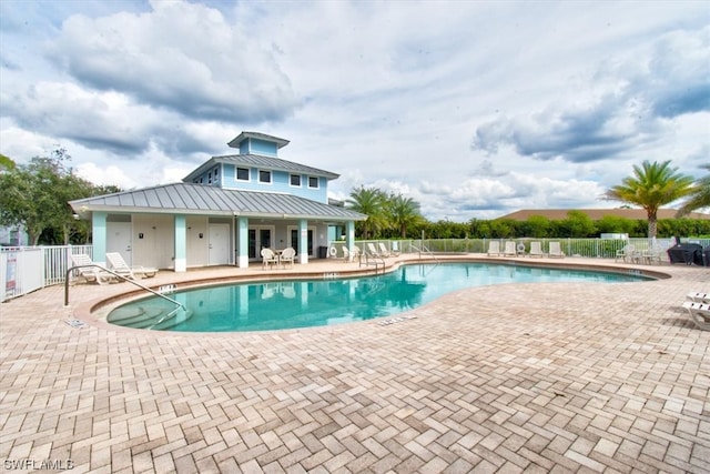 view of swimming pool featuring a patio area