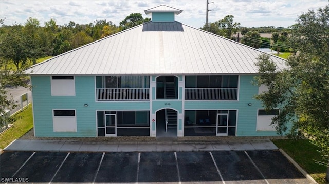 back of property featuring a balcony