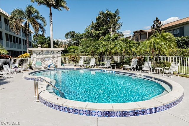 view of pool featuring a patio