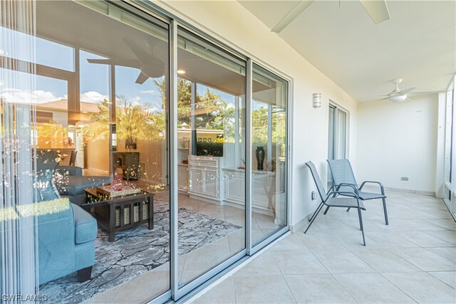 exterior space with light tile flooring and ceiling fan