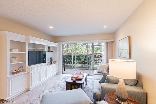 tiled living room with built in features and a textured ceiling