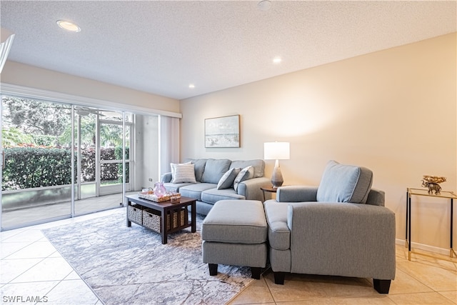 tiled living room with a textured ceiling