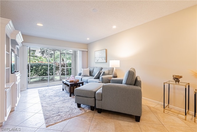 tiled living room with a textured ceiling