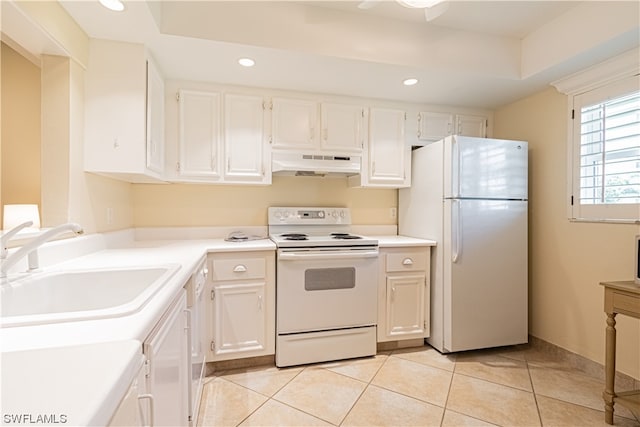 kitchen with white appliances, white cabinets, sink, and light tile flooring