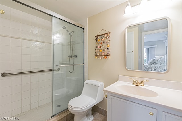 bathroom with an enclosed shower, toilet, and vanity