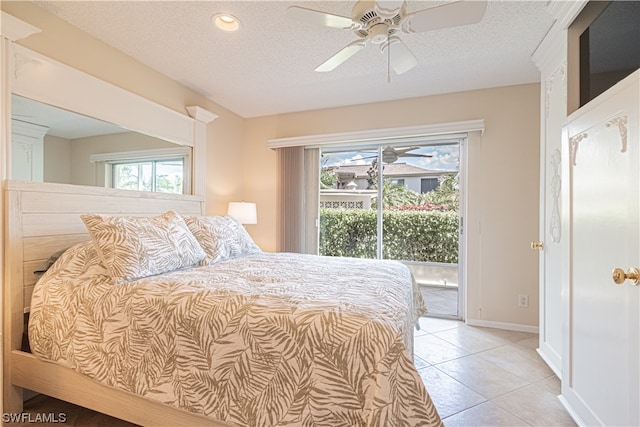 tiled bedroom with access to exterior, ceiling fan, and a textured ceiling