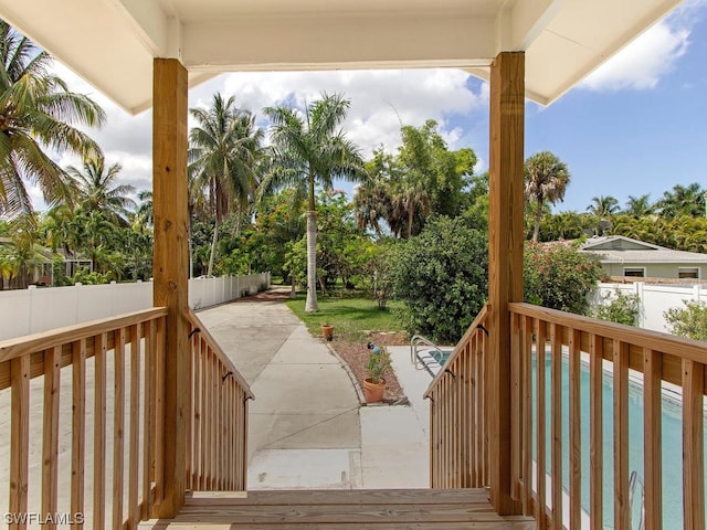 wooden terrace featuring a patio area