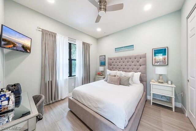 bedroom featuring ceiling fan and light wood-type flooring