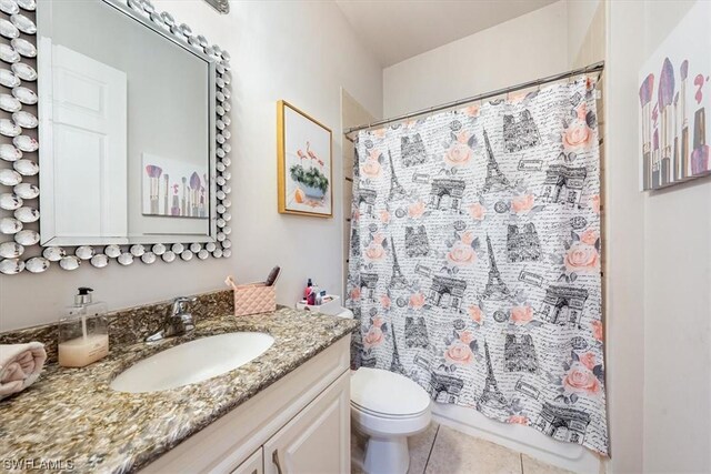 full bathroom featuring vanity, toilet, shower / bath combo, and tile patterned flooring