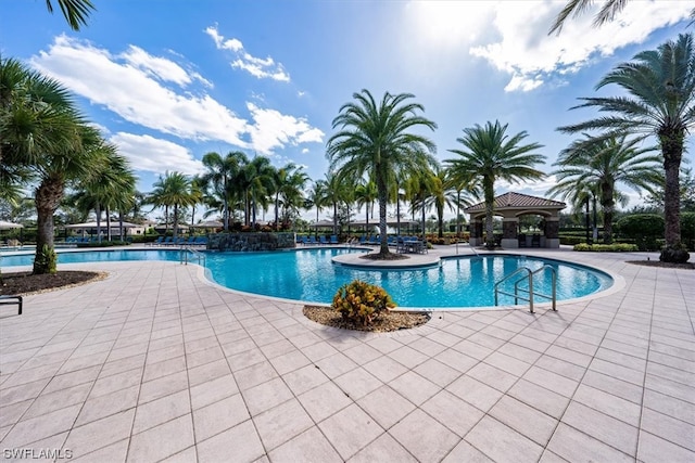 view of swimming pool with a patio area