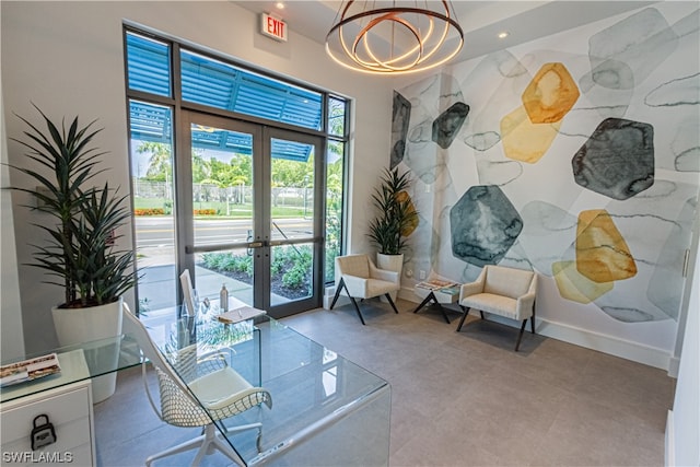 sitting room with light tile floors, french doors, and a wealth of natural light