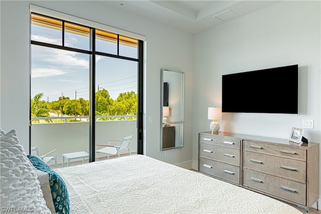 bedroom with multiple windows and access to exterior