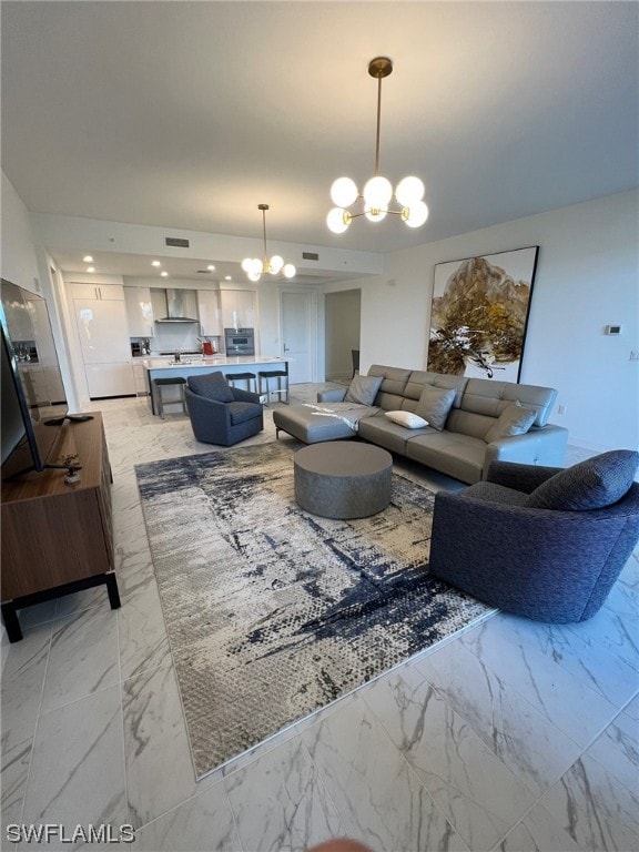 living room featuring a notable chandelier and light tile floors