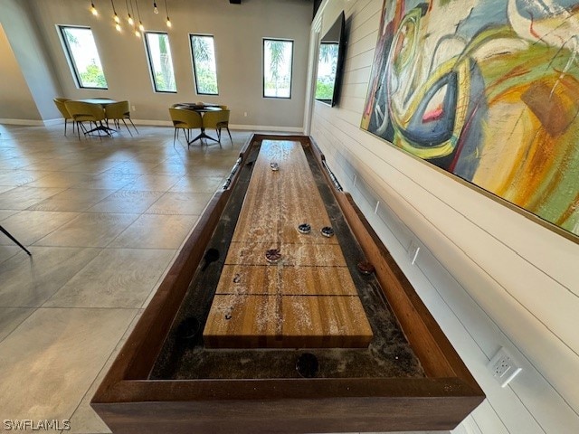 game room with tile flooring