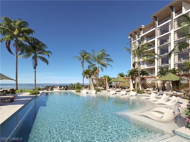 view of pool with a water view and a pergola