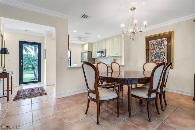 tiled dining room featuring ceiling fan with notable chandelier and crown molding