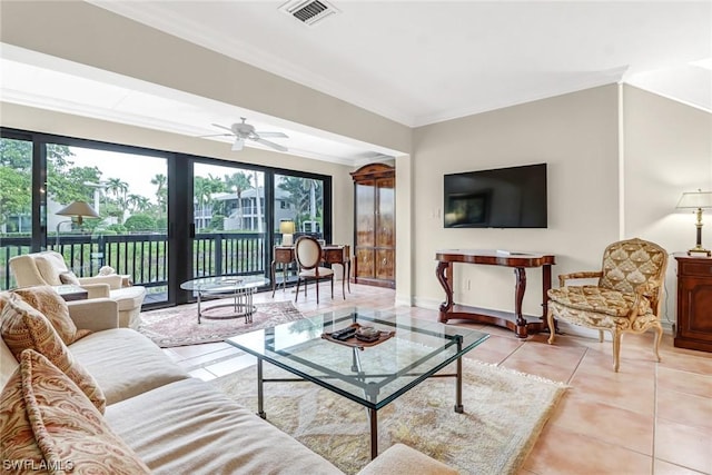 living room with light tile patterned floors, ceiling fan, and ornamental molding