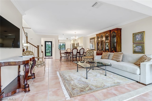 tiled living room with a chandelier and ornamental molding