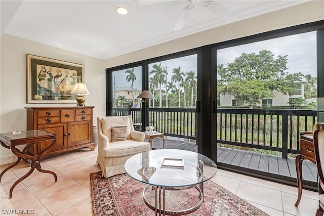 sunroom / solarium featuring ceiling fan