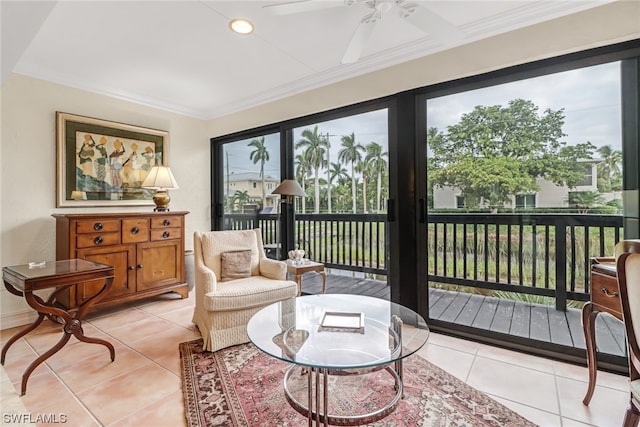 sunroom featuring ceiling fan