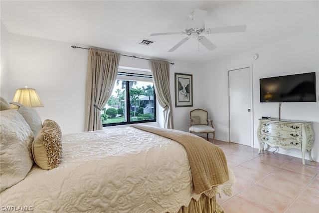 tiled bedroom with ceiling fan