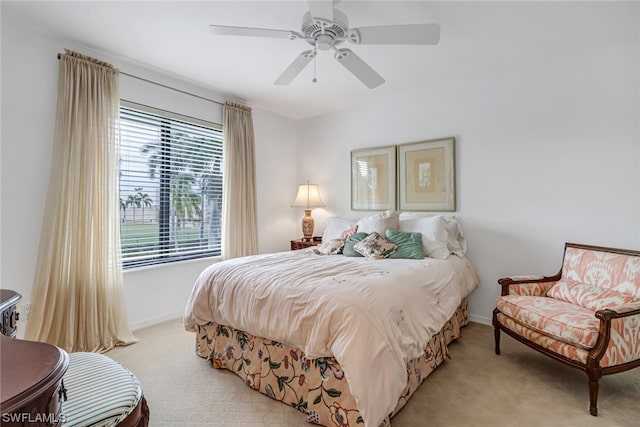 bedroom with ceiling fan and light colored carpet