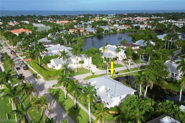 birds eye view of property featuring a water view