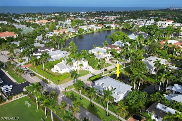 birds eye view of property with a water view