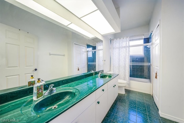 full bathroom featuring toilet, double sink, vanity with extensive cabinet space, tiled shower / bath, and tile flooring