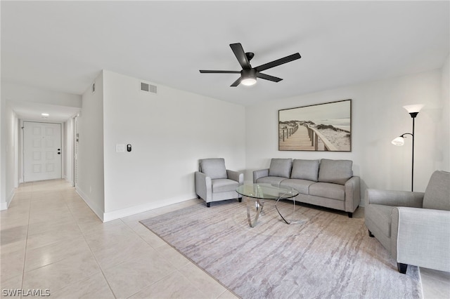 living room with light tile patterned flooring and ceiling fan