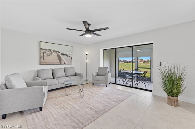 living room featuring light tile patterned flooring and ceiling fan