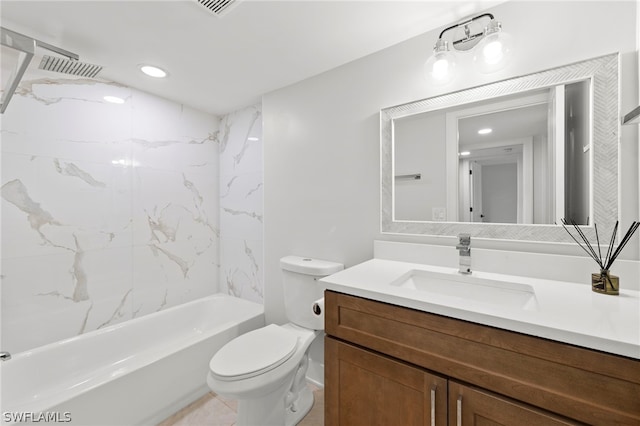 full bathroom featuring vanity, tile patterned flooring, tiled shower / bath combo, and toilet