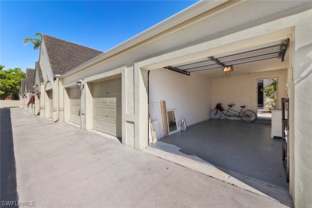 garage featuring a garage door opener