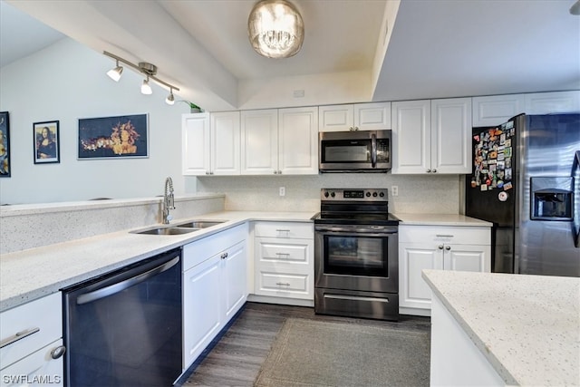 kitchen featuring sink, appliances with stainless steel finishes, dark hardwood / wood-style floors, and white cabinets