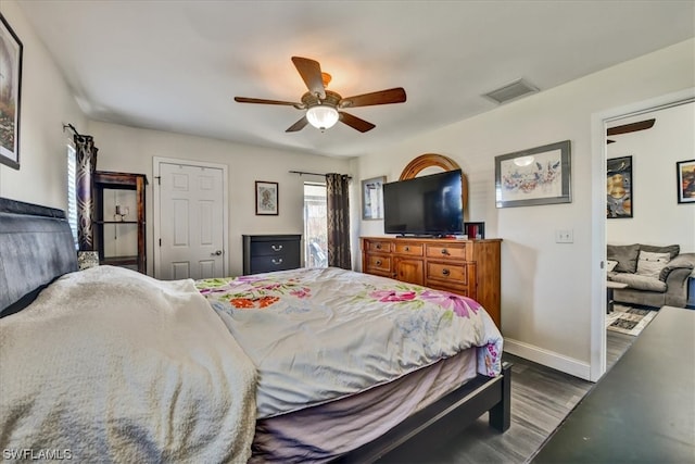 bedroom featuring dark wood-type flooring and ceiling fan