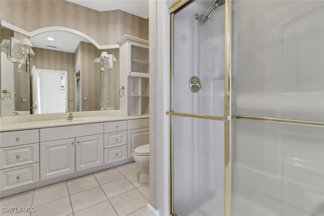 bathroom featuring a shower with shower door, tile patterned floors, toilet, and vanity