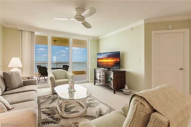 living room featuring crown molding, light colored carpet, ceiling fan, and expansive windows