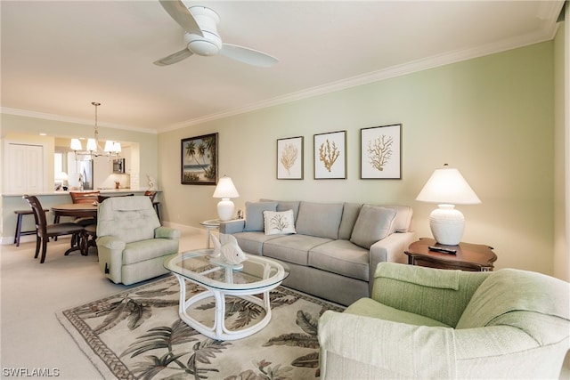 carpeted living room with crown molding and ceiling fan with notable chandelier