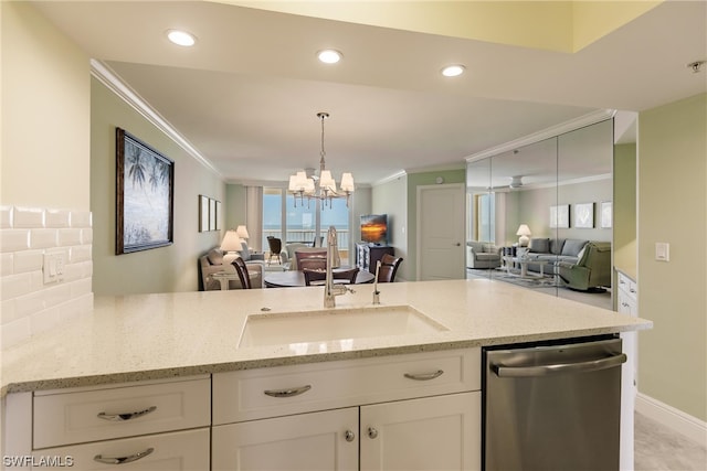 kitchen featuring a chandelier, dishwasher, and crown molding