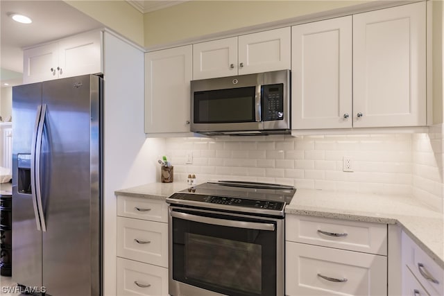 kitchen with white cabinets, backsplash, stainless steel appliances, and light stone counters