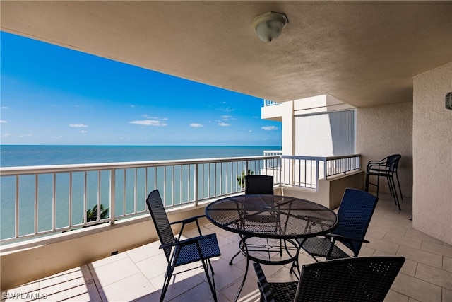 balcony featuring a water view