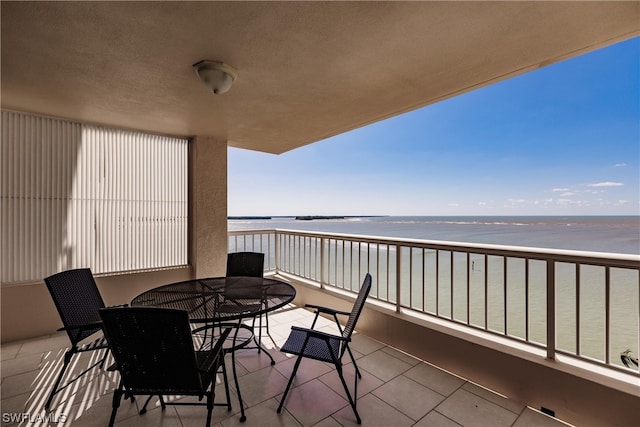 balcony featuring a water view