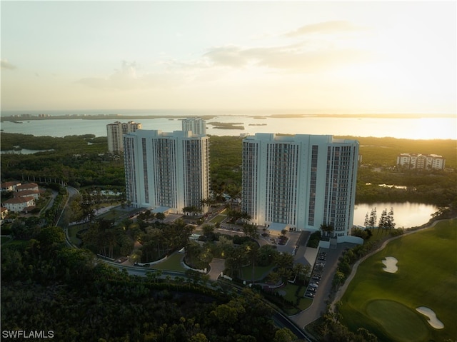 aerial view at dusk with a water view