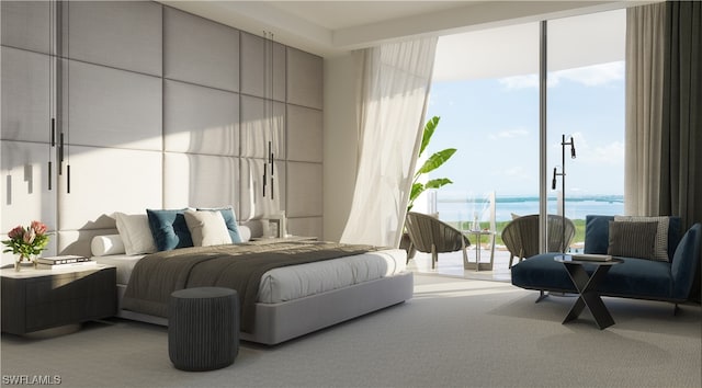 carpeted bedroom with access to exterior and a water view