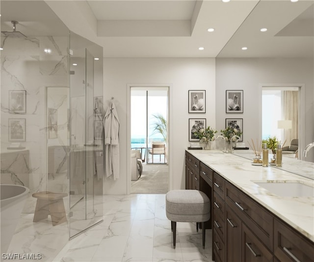 bathroom featuring a healthy amount of sunlight, vanity with extensive cabinet space, separate shower and tub, and tile floors