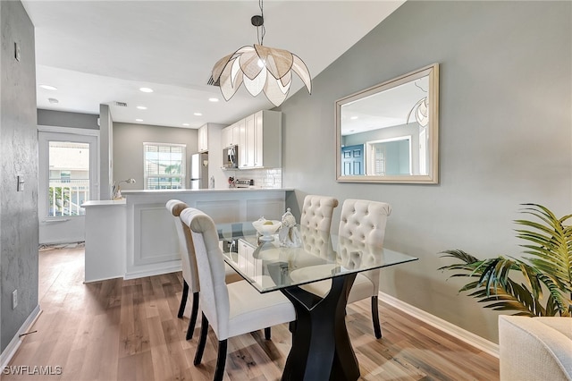 dining room with light wood-type flooring