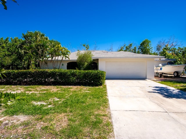 ranch-style home with a garage