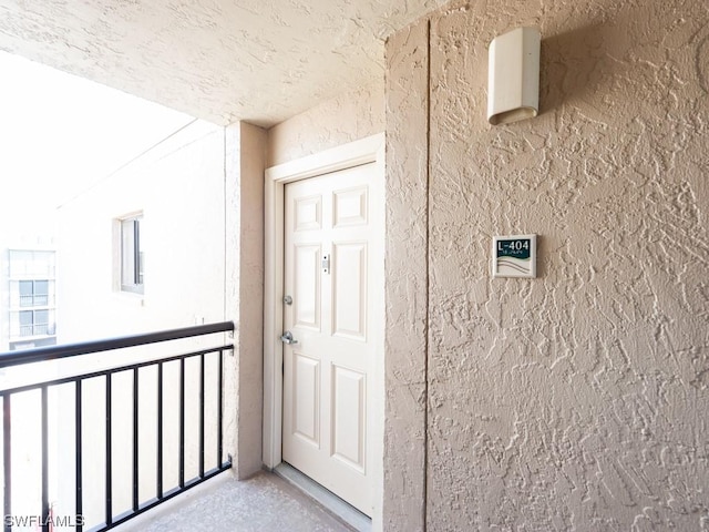 doorway to property with a balcony