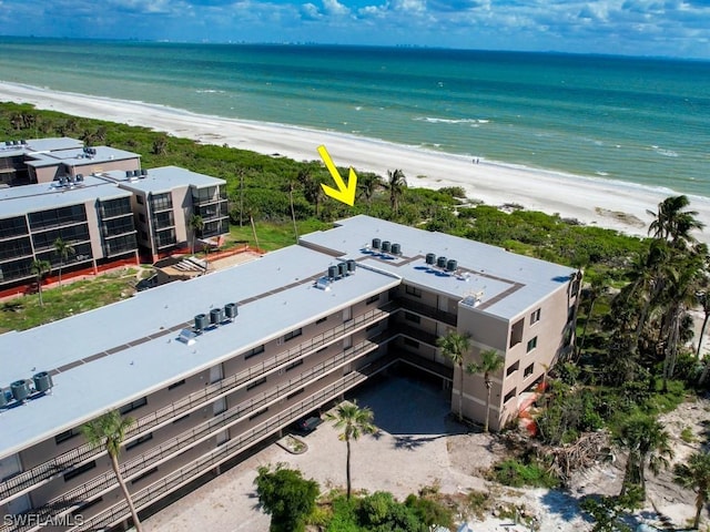 aerial view featuring a water view and a beach view